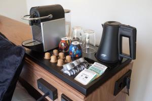 a black table with a coffee maker on it at Boetiekpark 't Zwaantje in Mook