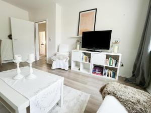 TV a/nebo společenská místnost v ubytování Ferienwohnung am Olantis
