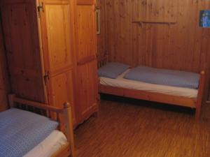 Una cama o camas en una habitación de Haus Belluti Graun