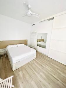 Cama o camas de una habitación en Apartamentos Hotel Puente de Hierro