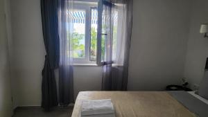 Posteľ alebo postele v izbe v ubytovaní Apartments Amadea