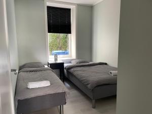 En eller flere senge i et værelse på Ålesund City Center - Modern 80-m2 flat with 3 bedrooms