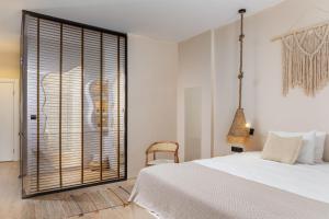 Łóżko lub łóżka w pokoju w obiekcie Gran Via Alsancak