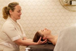 a woman in a spa getting her hair done at La Ferme D'Augustin in Saint-Tropez