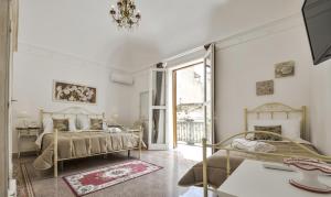 Postel nebo postele na pokoji v ubytování TAM Vacanze B&B