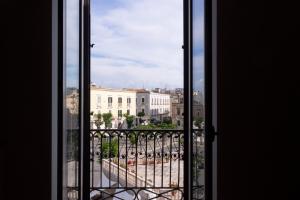 a view of a city from an open window at Seaport #Apartment in Trani