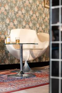 a white chair sitting on top of a table at greet Chartres Est in Chartres