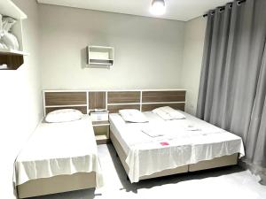 Tempat tidur dalam kamar di Hotel Estação Sé