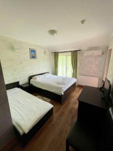 Ένα ή περισσότερα κρεβάτια σε δωμάτιο στο Lacul de Argint - Silver Lake