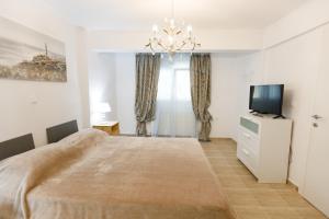 Posteľ alebo postele v izbe v ubytovaní Breeze apartment