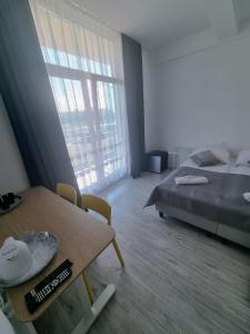 Postel nebo postele na pokoji v ubytování Figaro Apartaments