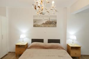 Posteľ alebo postele v izbe v ubytovaní Breeze apartment + 37 fotografií
