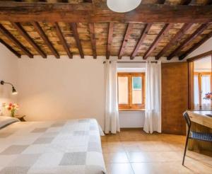 a bedroom with a large bed in a room at Albergo Dal Fata in Gambassi Terme