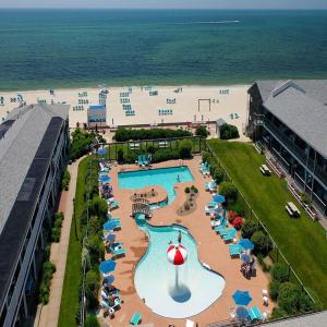an aerial view of a resort with a pool and a beach at Riviera Beach Resort in South Yarmouth