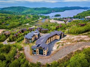 an aerial view of a home with a large house at Horizon 306/Spacious Penthouse with View in Mont-Tremblant