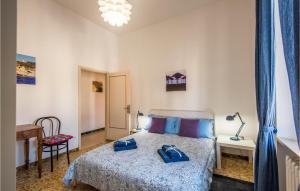a bedroom with a bed with blue shoes on it at Beautiful Apartment In Monte San Savino With 2 Bedrooms And Wifi in Monte San Savino