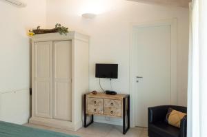 TV a/nebo společenská místnost v ubytování La Casa di Alice Smeralda