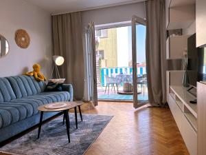 Televízia a/alebo spoločenská miestnosť v ubytovaní Morskie Boho Gdynia Rental