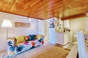 a living room with a couch and a kitchen at Dolls House at downtown in Lisbon