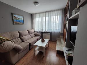 a living room with a couch and a table at La Tablada in Recuevo