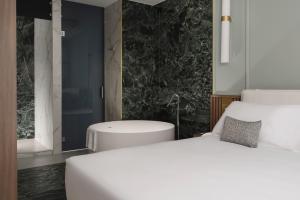 Postel nebo postele na pokoji v ubytování Parioli Hotel Rimini