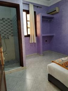 Postel nebo postele na pokoji v ubytování Riad Rayan's Guests