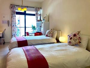 Tempat tidur dalam kamar di 心適都蘭Comfy Inn, Dulan