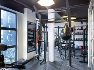 a fitness room with a gym with tread machines at Pacific Hotel in Phnom Penh