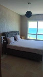 Кровать или кровати в номере AppartF3 vue panoramique sur mer