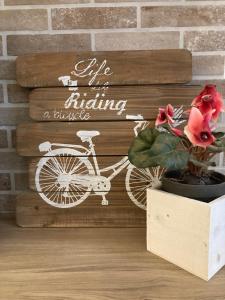 a sign that says life is riding a bicycle at Tiny House in the center in Torri del Benaco