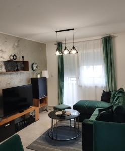 TV a/nebo společenská místnost v ubytování Apartman Green!!