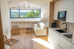 Kuchyňa alebo kuchynka v ubytovaní Apartamentos Boutique Aroca