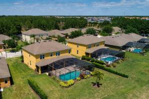 an aerial view of a house with a swimming pool at 535 -Villa Belvedere, A Stunning, Spacious 5 Bed Lake View Home with Pool and Spa in Davenport