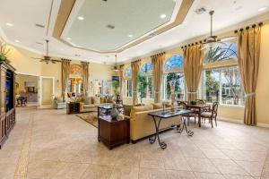 a living room with a couch and a table at 535 -Villa Belvedere, A Stunning, Spacious 5 Bed Lake View Home with Pool and Spa in Davenport