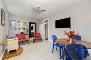 a living room with a table and chairs at Stylish Private 2 Bed Apt in Harrisburg
