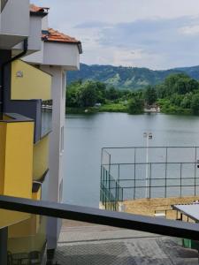 a view of a lake from the balcony of a building at Studio Emilija A30 A42 in Veliko Gradište
