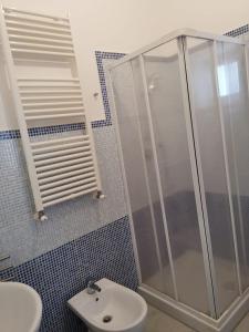 a bathroom with a shower and a sink at Il Vico in Gaeta