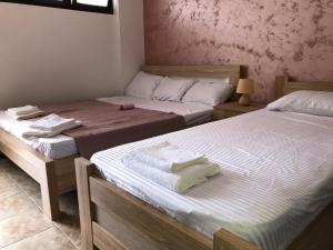 Postel nebo postele na pokoji v ubytování Apartman Cmiljanic