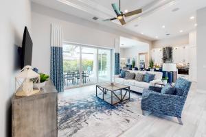 a living room with a couch and a table at Island Escape in Marco Island