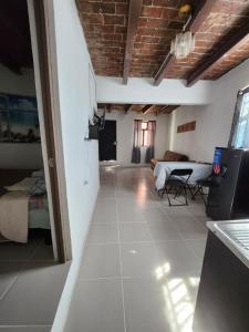 a living room with a couch and a table at Casa Linda Vista in Guanajuato