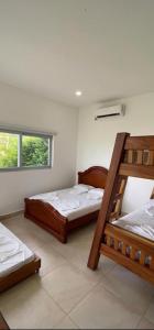 Ein Bett oder Betten in einem Zimmer der Unterkunft Villa Guadalupe