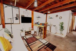 a living room with a couch and a table in a room at Acogedor apartamento cerca al mar. in Lima