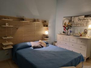 Un pat sau paturi într-o cameră la Casa Vacanza La Via Del Cinabro