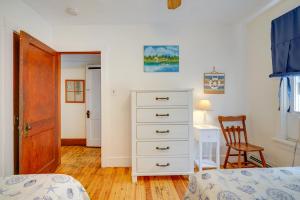 a bedroom with a bed and a dresser and a desk at Wildwood Apartment - Porch and Enclosed Sunroom! in Wildwood