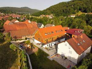 an aerial view of a house with orange roofs at Belzesaltescheune Heuboden Rhön in Riedenberg