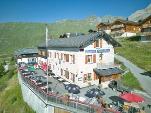 an aerial view of a building with a restaurant at Hotel Aletschhorn in Belalp