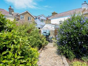 a house with a garden and some bushes at Bari in Aberaeron