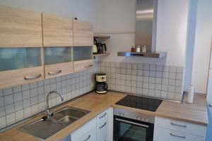 a kitchen with a sink and a counter top at Im Beilsteiner Mühlental in Beilstein