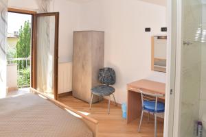 Postel nebo postele na pokoji v ubytování B&B agli Ulivi