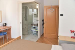 Postel nebo postele na pokoji v ubytování B&B agli Ulivi